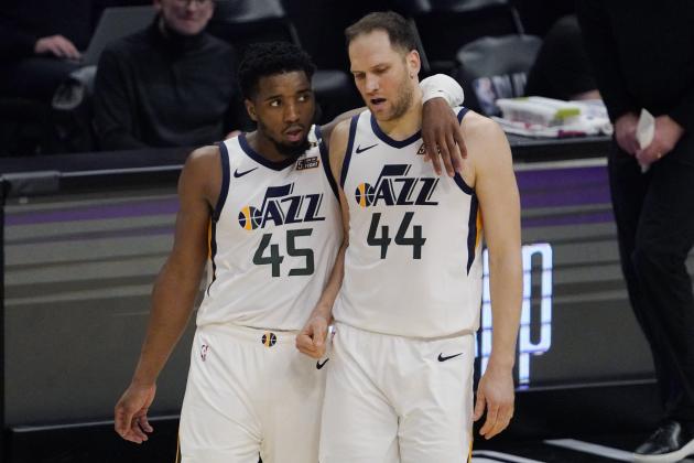 Utah Jazz guard Donovan Mitchell, left, puts his arm around forward Bojan Bogdanovic in the closing minutes of the second half in Game 6 of a second-round NBA basketball playoff series Friday, June 18, 2021, in Los Angeles. (AP Photo/Mark J. Terrill)