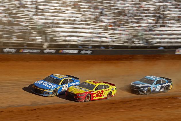 Driver Daniel Suarez (99) leads Joey Logano (22), and Martin Truex Jr. (19) during an NASCAR Cup Series auto race, Monday, March 29, 2021, in Bristol, Tenn. (AP Photo/Wade Payne)
