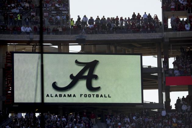 Fans stand before the start of an NCAA college football game between LSU and Alabama at Bryant-Denny Stadium, in Tuscaloosa, Ala., Saturday, Nov. 9, 2019. (AP Photo/Andrew Harnik)