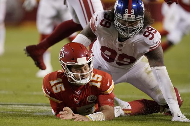Kansas City Chiefs quarterback Patrick Mahomes (15) is slow to get up after throwing under pressure from New York Giants defensive end Leonard Williams (99) during the first half of an NFL football game Monday, Nov. 1, 2021, in Kansas City, Mo. (AP Photo/Charlie Riedel)