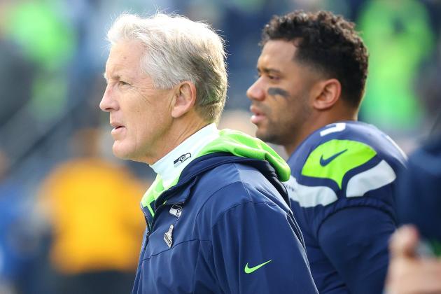 SEATTLE, WASHINGTON - NOVEMBER 21: Head Coach Pete Carroll of the Seattle Seahawks and Russell Wilson #3 look on before the game against the Arizona Cardinals at Lumen Field on November 21, 2021 in Seattle, Washington. (Photo by Abbie Parr/Getty Images)