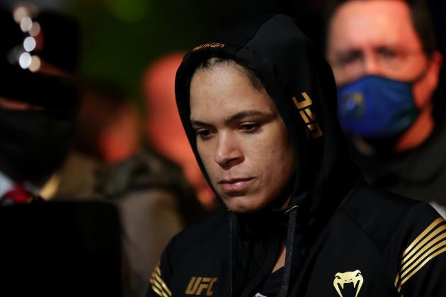 LAS VEGAS, NEVADA - DECEMBER 11: Amanda Nunes of Brazil enters the octagon for her women's bantamweight title fight against Julianna Pena during the UFC 269 event at T-Mobile Arena on December 11, 2021 in Las Vegas, Nevada. (Photo by Carmen Mandato/Getty Images)