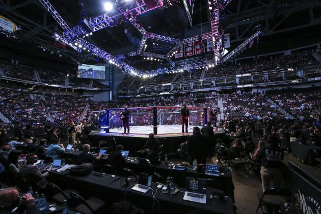 Fans await the next fight during a UFC 261 mixed martial arts event, Saturday, April 24, 2021, in Jacksonville, Fla. It is the first UFC event since the onset of the COVID-19 pandemic to feature a full crowd in attendance. (AP Photo/Gary McCullough)
