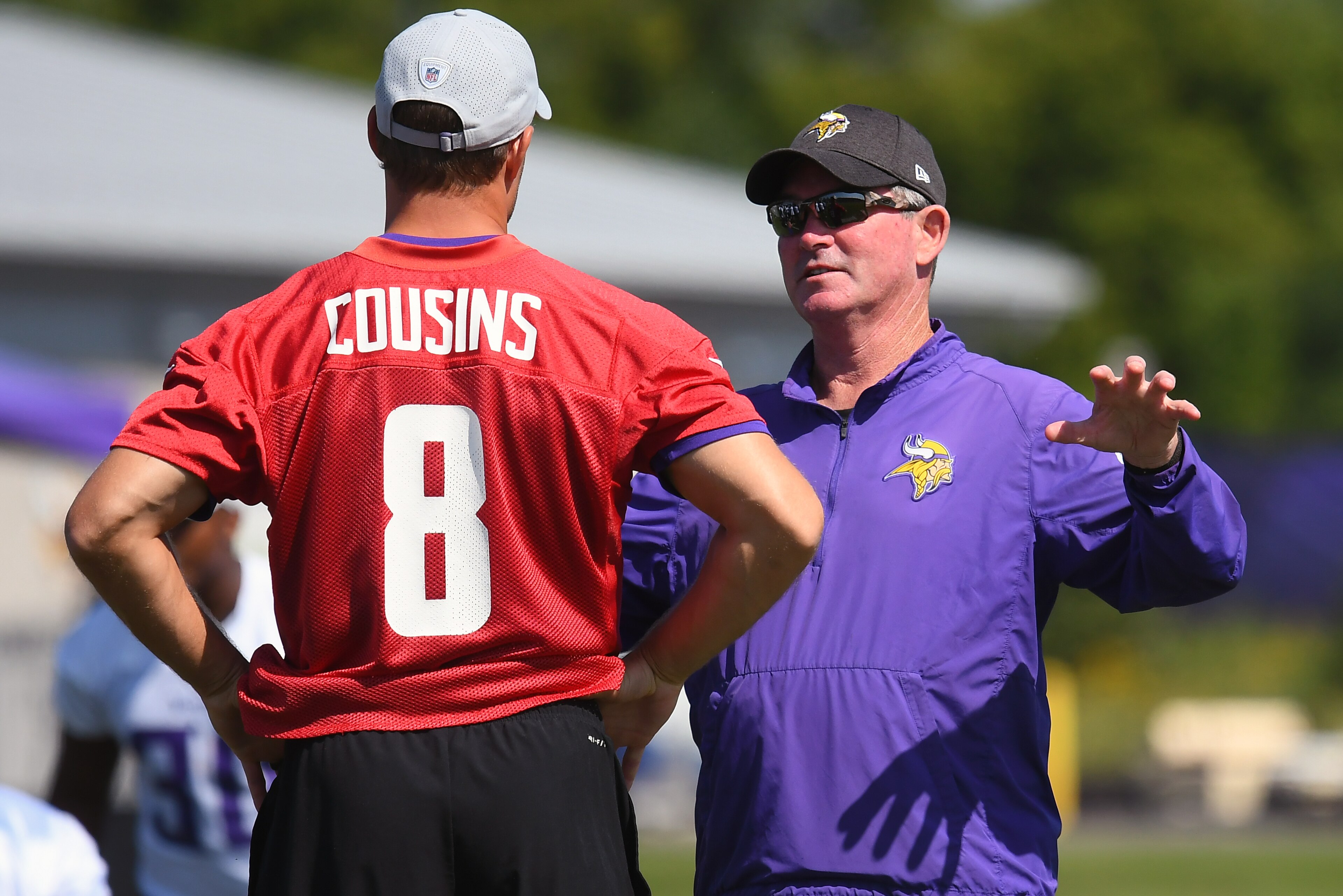 EAGAN, MN - JULY 30: Minnesota Vikings quarterback Kirk Cousins (8) takes direction from Minnesota Vikings Head Coach Mike Zimmer during training camp on July 30, 2018 at Twin Cities Orthopedics Performance Center in Eagan, MN.(Photo by Nick Wosika/Icon Sportswire via Getty Images) EAGAN, MN - JULY 30: Minnesota Vikings quarterback Kirk Cousins (8) takes direction from Minnesota Vikings Head Coach Mike Zimmer during training camp on July 30, 2018 at Twin Cities Orthopedics Performance Center in Eagan, MN.(Photo by Nick Wosika/Icon Sportswire via Getty Images)