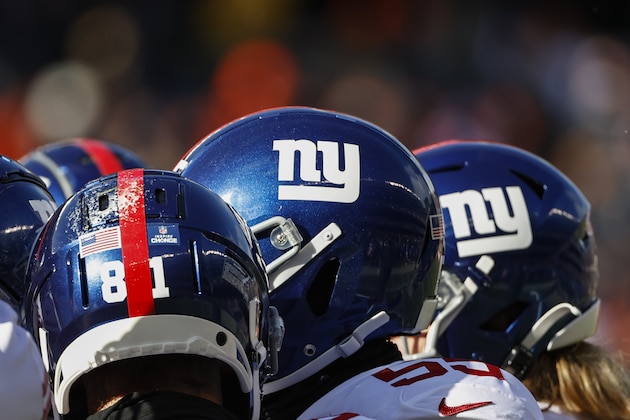 Helmets of New York Giants players are seen during the first half of an NFL football game against the Chicago Bears, Sunday, Jan. 2, 2022, in Chicago. (AP Photo/Kamil Krzaczynski) Helmets of New York Giants players are seen during the first half of an NFL football game against the Chicago Bears, Sunday, Jan. 2, 2022, in Chicago. (AP Photo/Kamil Krzaczynski)