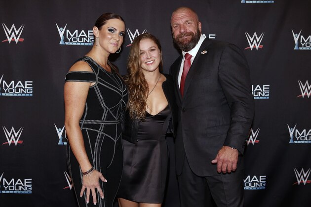 IMAGE DISTRIBUTED FOR WWE - WWE Chief Brand Officer Stephanie McMahon, left, Ronda Rousey, center, and WWE EVP of Talent, Live Events and Creative Paul