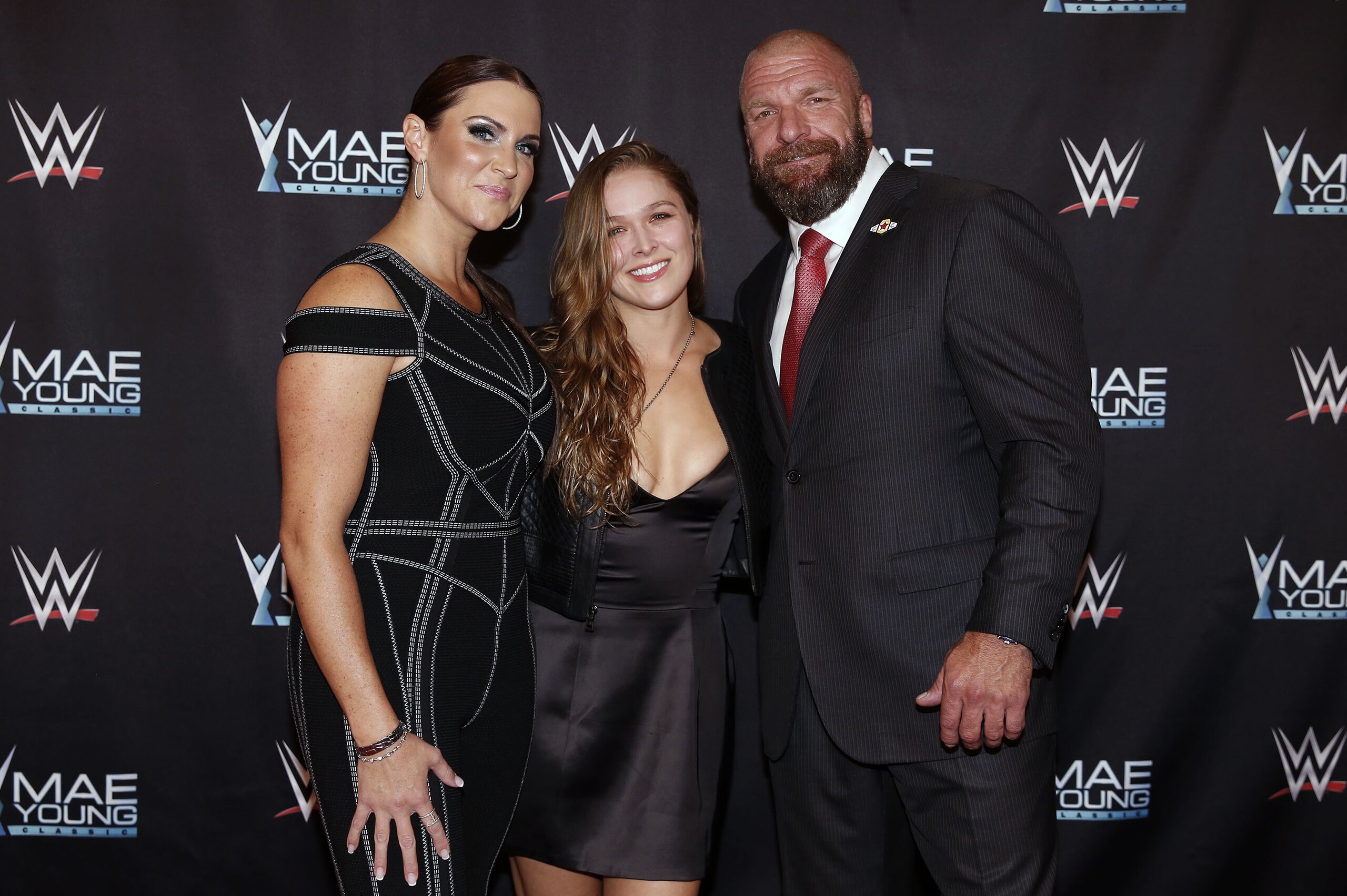 IMAGE DISTRIBUTED FOR WWE - WWE Chief Brand Officer Stephanie McMahon, left, Ronda Rousey, center, and WWE EVP of Talent, Live Events and Creative Paul
