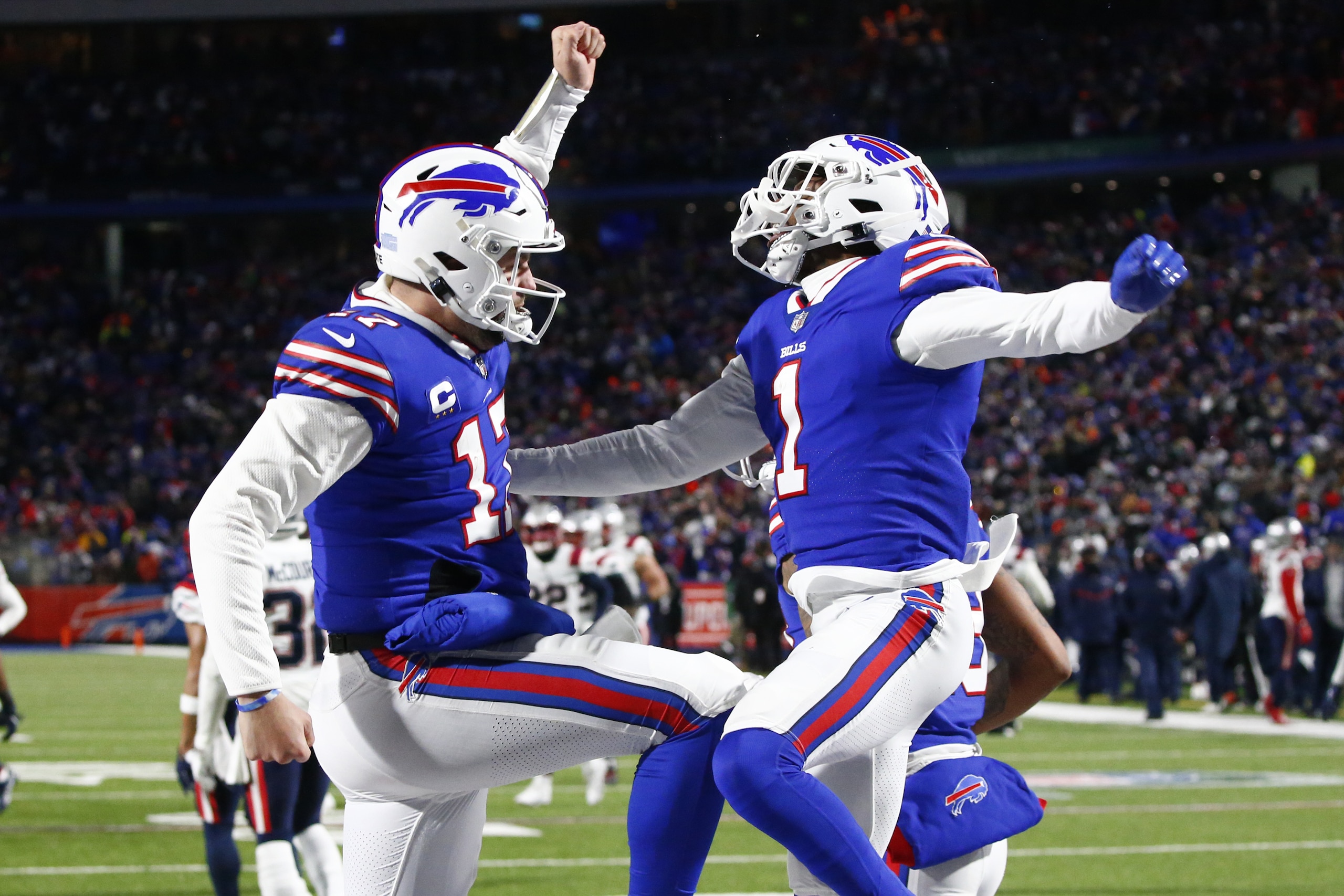 Buffalo Bills quarterback Josh Allen (17) and wide receiver Emmanuel Sanders (1) celebrate during the second half of an NFL wild-card playoff football game against the New England Patriots in Orchard Park, N.Y., Saturday, Jan. 15, 2022. (AP Photo/ Jeffrey T. Barnes)