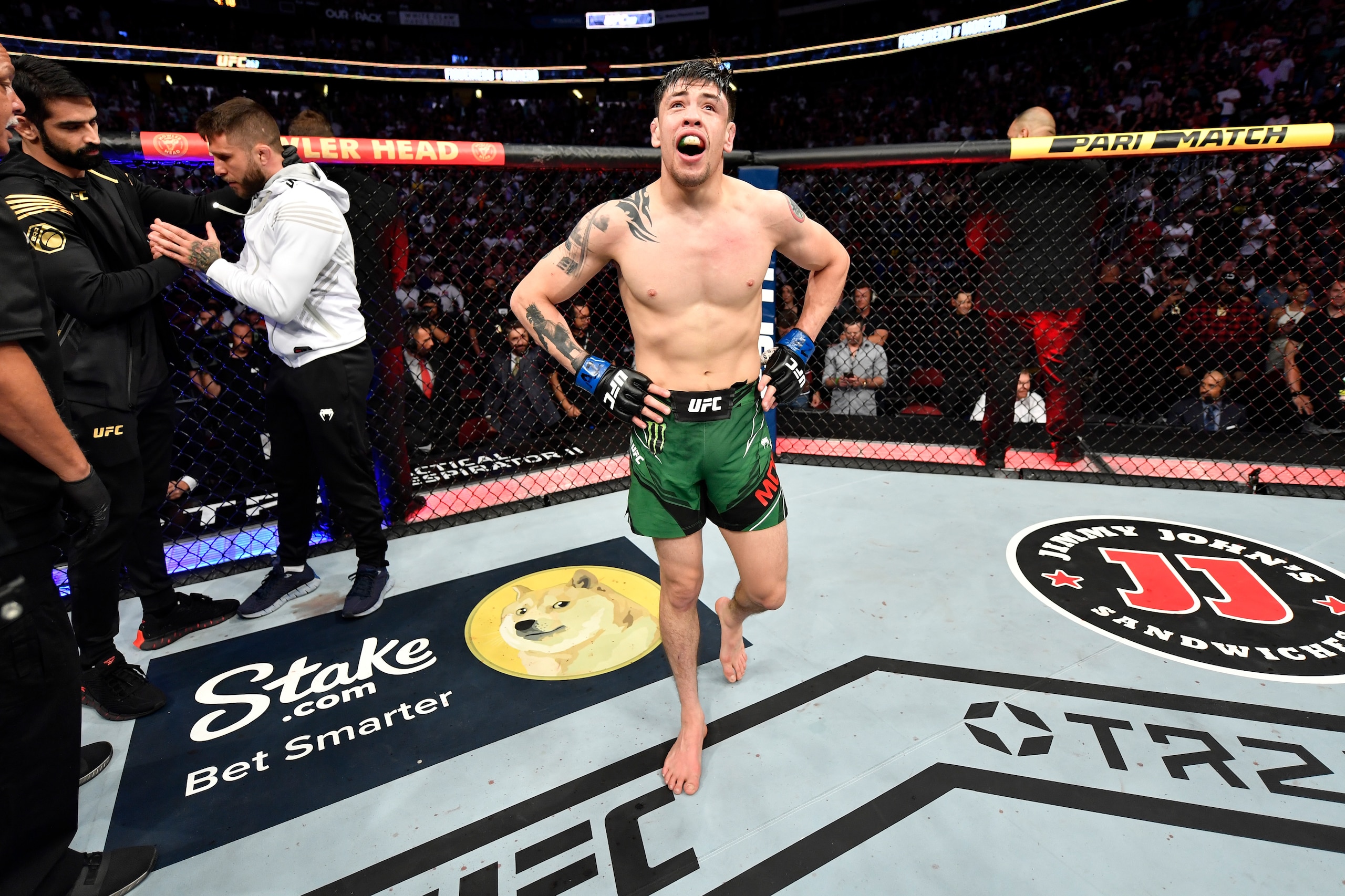 GLENDALE, ARIZONA - JUNE 12:  Brandon Moreno reacts after defeating Deiveson Figueiredo in their flyweight championship bout during the UFC 263 event at the Gila River Arena on June 12, 2021 in Glendale, Arizona. (Photo by Jeff Bottari/Zuffa LLC via Getty Images)