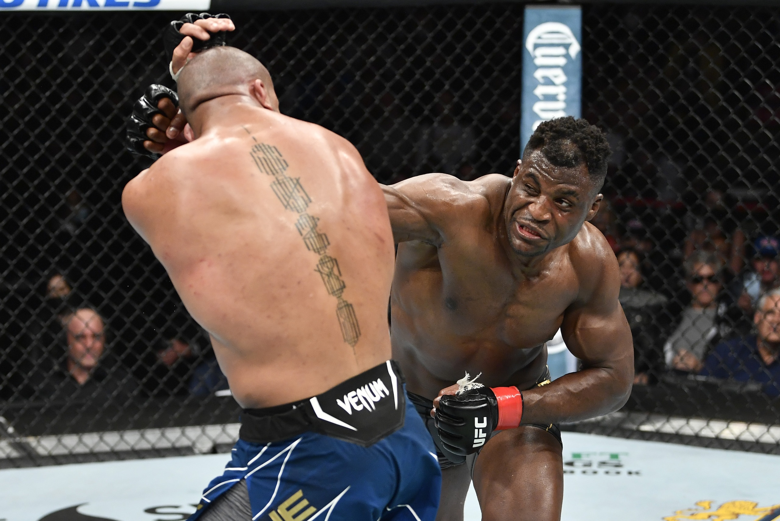 ANAHEIM, CALIFORNIA - JANUARY 22: (R-L) Francis Ngannou of Cameroon punches Ciryl Gane of France in their UFC heavyweight championship fight during the UFC 270 event at Honda Center on January 22, 2022 in Anaheim, California. (Photo by Chris Unger/Zuffa LLC)