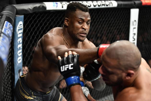 ANAHEIM, CALIFORNIA - JANUARY 22: (L-R) Francis Ngannou of Cameroon punches Ciryl Gane of France in their UFC heavyweight championship fight during the UFC 270 event at Honda Center on January 22, 2022 in Anaheim, California. (Photo by Chris Unger/Zuffa LLC)