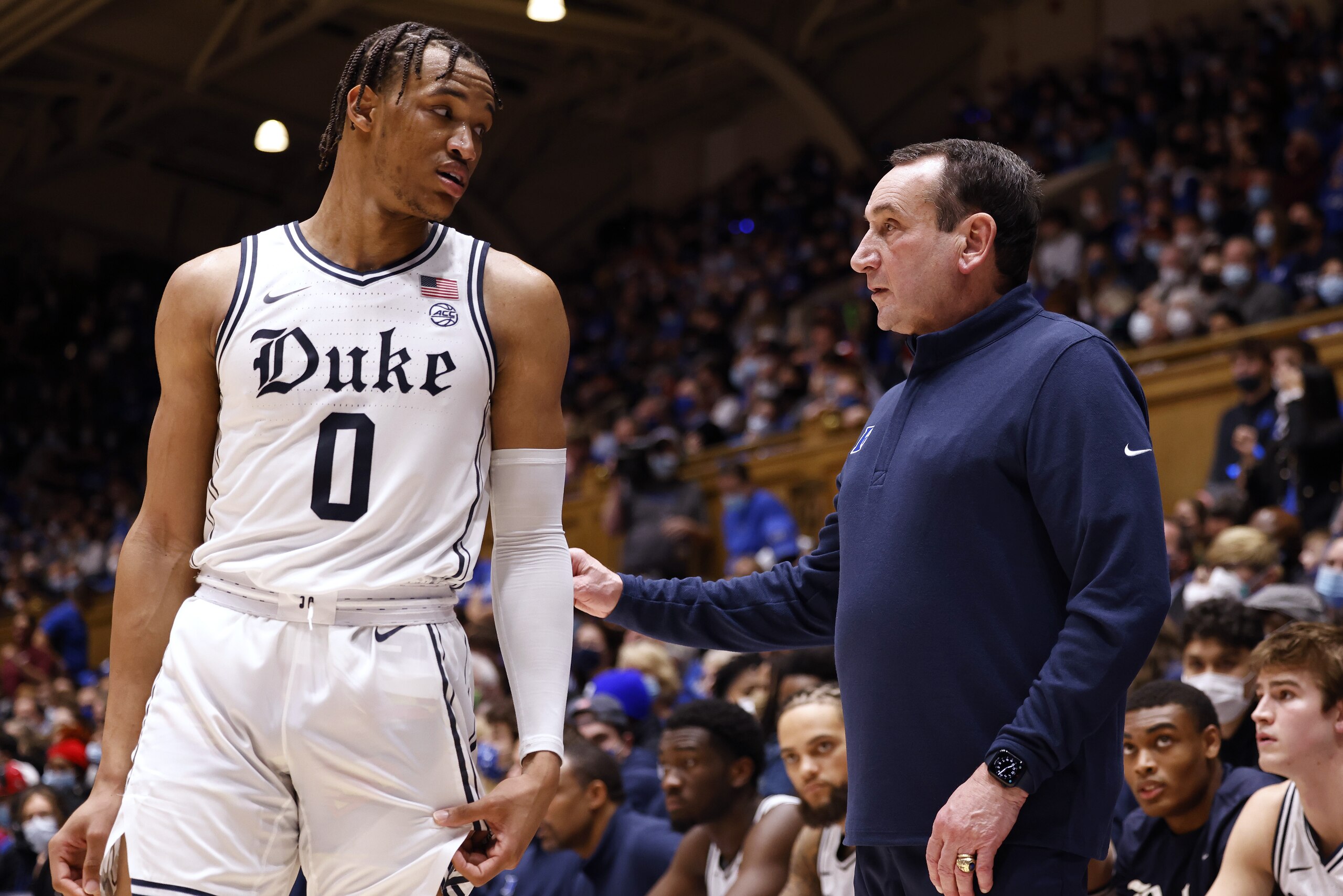 DURHAM, NORTH CAROLINA - DECEMBER 22: Wendell Moore Jr. #0 talks with head coach Mike Krzyzewski of the Duke Blue Devils during the second half of their game against the Virginia Tech Hokies at Cameron Indoor Stadium on December 22, 2021 in Durham, North Carolina. (Photo by Grant Halverson/Getty Images)