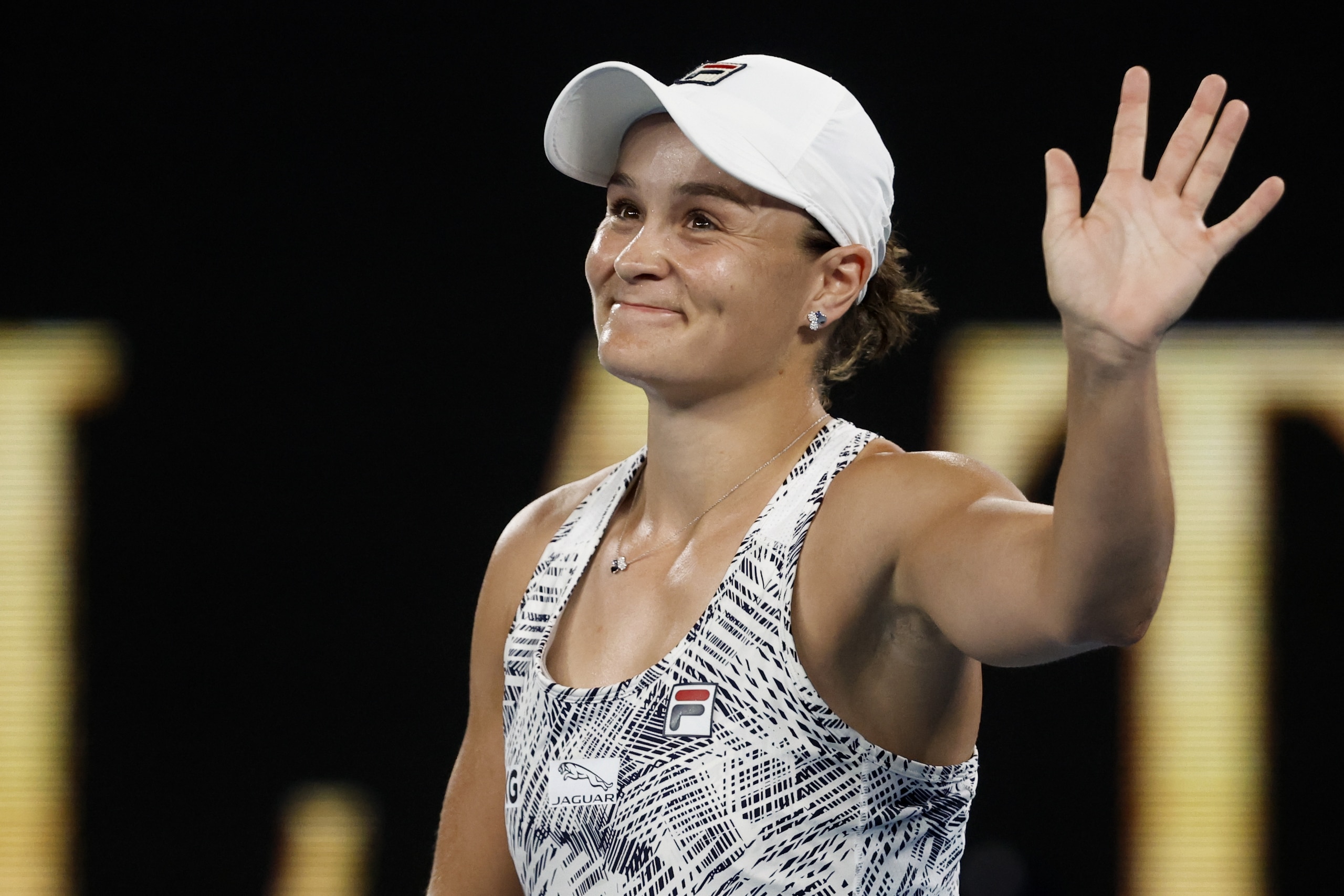 Ash Barty of Australia waves after defeating Madison Keys of the U.S. in their semifinal match at the Australian Open tennis championships in Melbourne, Australia, Thursday, Jan. 27, 2022. (AP Photo/Hamish Blair)