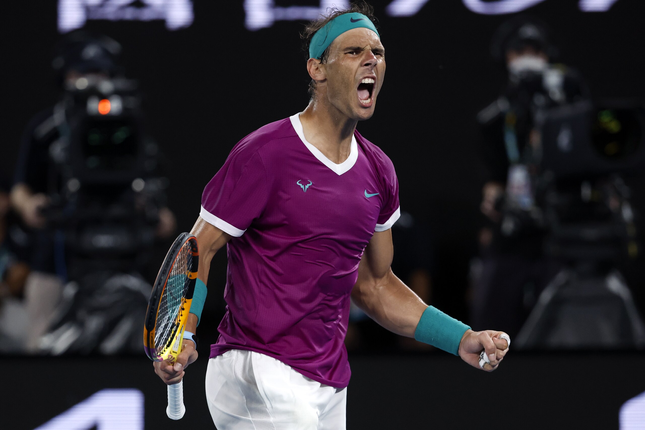 Rafael Nadal of Spain reacts after winning the third set against Daniil Medvedev of Russia during the men's singles final at the Australian Open tennis championships in Melbourne, Australia, Sunday, Jan. 30, 2022. (AP Photo/Hamish Blair)