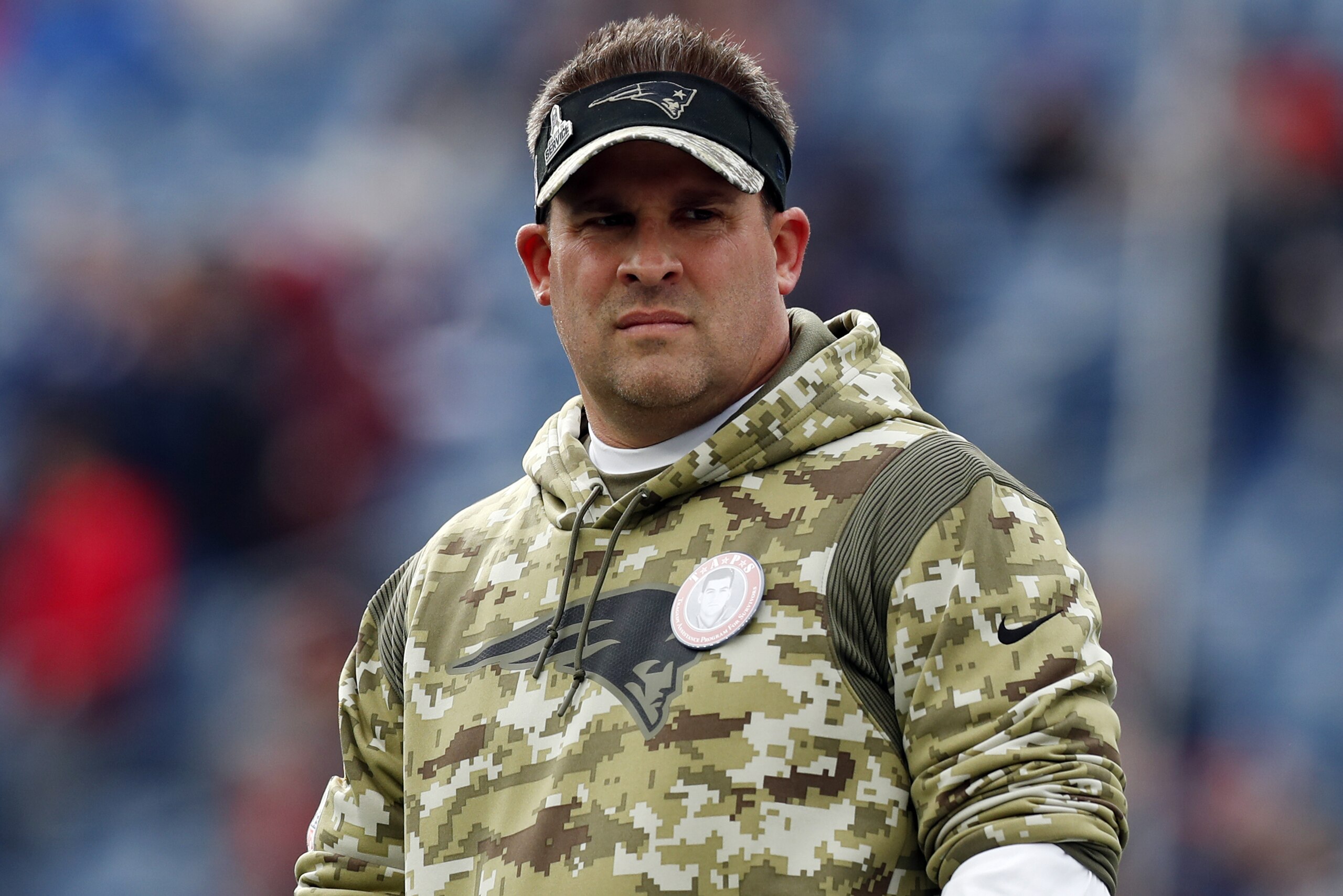 FILE - New England Patriots offensive coordinator Josh McDaniels looks on prior to an NFL football game Nov. 14, 2021, in Foxborough, Mass. The Las Vegas Raiders have made a request to interview the Patriots' McDaniels for their head coach opening. A person familiar with the search said Thursday, Jan. 27, 2022, the Raiders made the request to speak with McDaniels about filling the void left when Jon Gruden resigned in October. The person spoke on condition of anonymity because the team was not announcing its candidates. (AP Photo/Michael Dwyer, File)