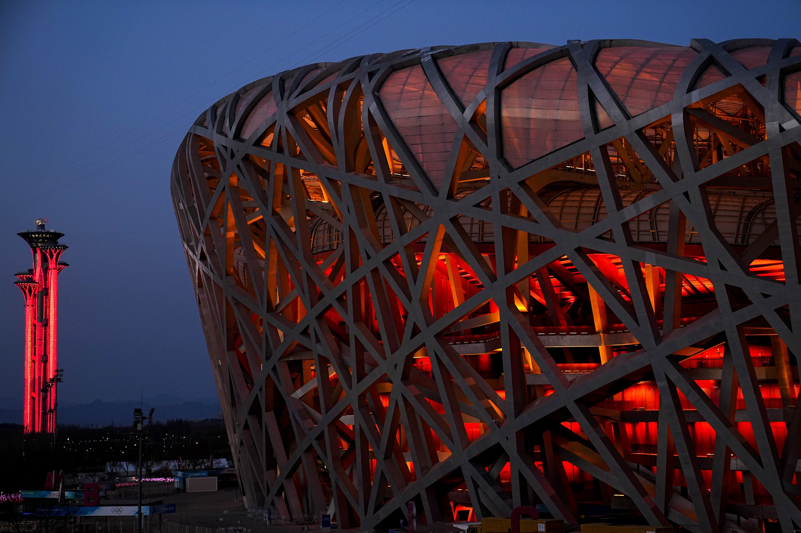 FILE - The National Stadium and the Beijing Olympic Tower are lit in red on the eve of the Chinese New Year ahead of the 2022 Winter Olympics, Jan. 31, 2022, in Beijing. (AP Photo/Jae C. Hong, File) FILE - The National Stadium and the Beijing Olympic Tower are lit in red on the eve of the Chinese New Year ahead of the 2022 Winter Olympics, Jan. 31, 2022, in Beijing. (AP Photo/Jae C. Hong, File)