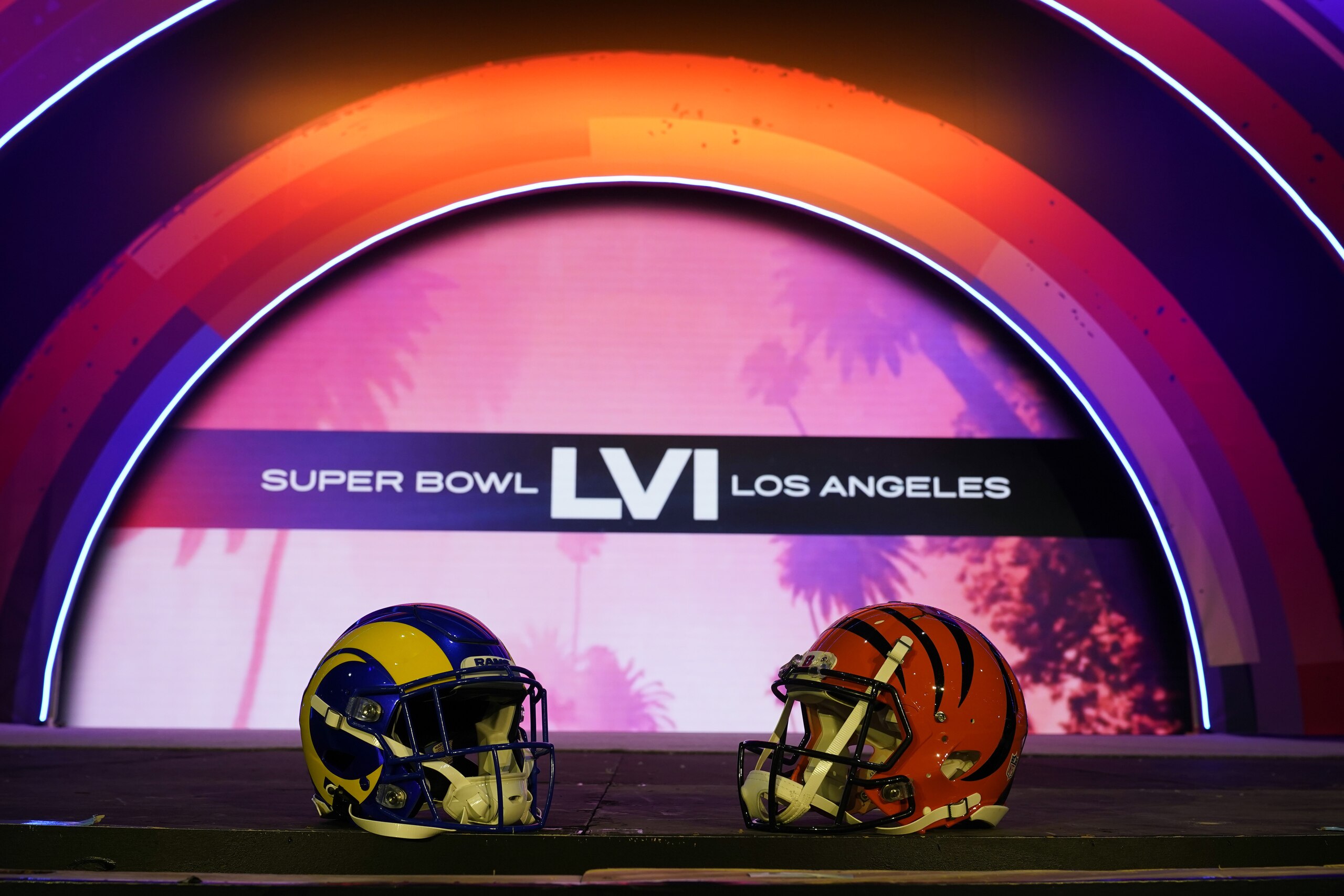 Los Angeles Rams and Cincinnati Bengals helmets sit on a stage inside the NFL Experience, an interactive fan show, Friday, Feb. 4, 2022, at the Los Angeles Convention Center in Los Angeles. The Los Angeles Rams are scheduled to play the Cincinnati Bengals in the Super Bowl NFL football game Feb. 13 in Inglewood, Calif. (AP Photo/Marcio Jose Sanchez)