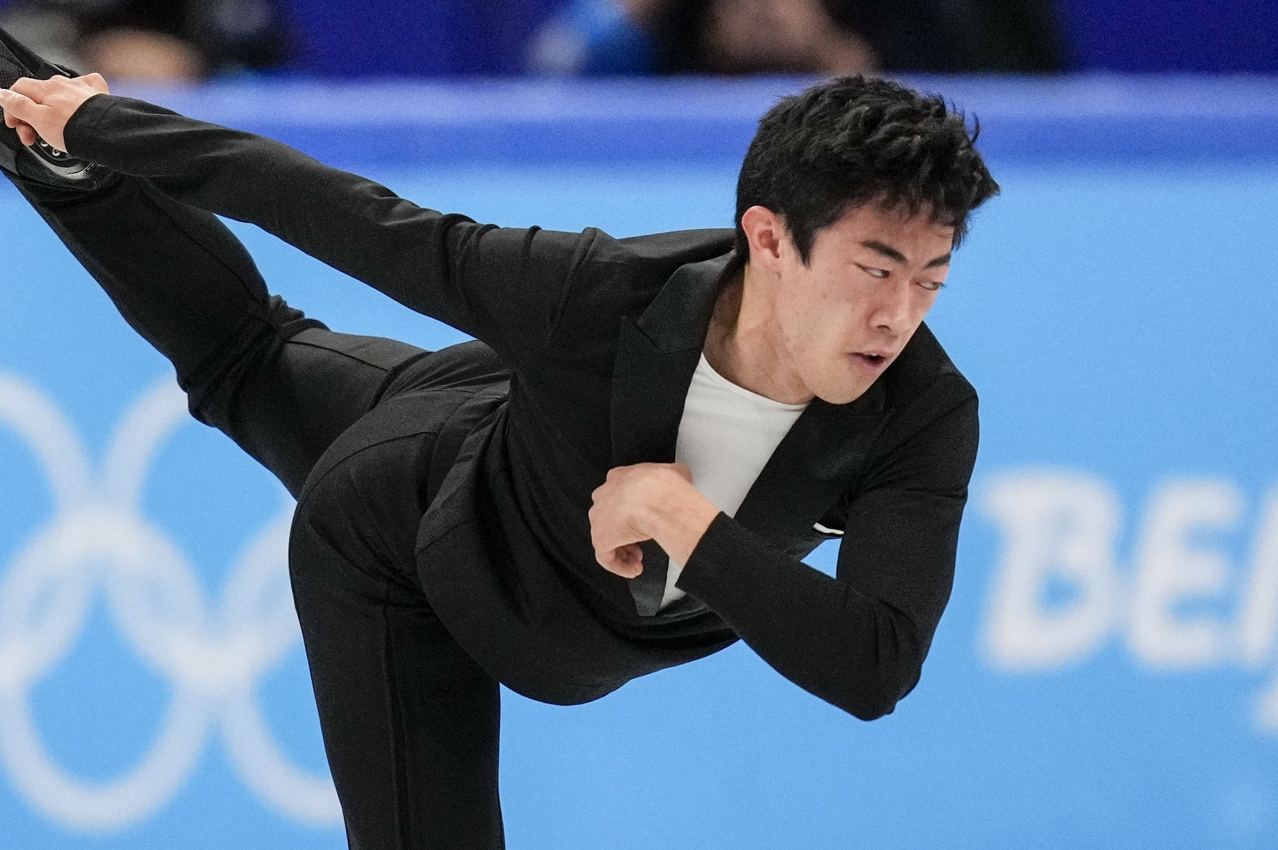 Nathan Chen, of the United States, competes during the men's singles short program team event in the figure skating competition at the 2022 Winter Olympics, Friday, Feb. 4, 2022, in Beijing. (AP Photo/Bernat Armangue)