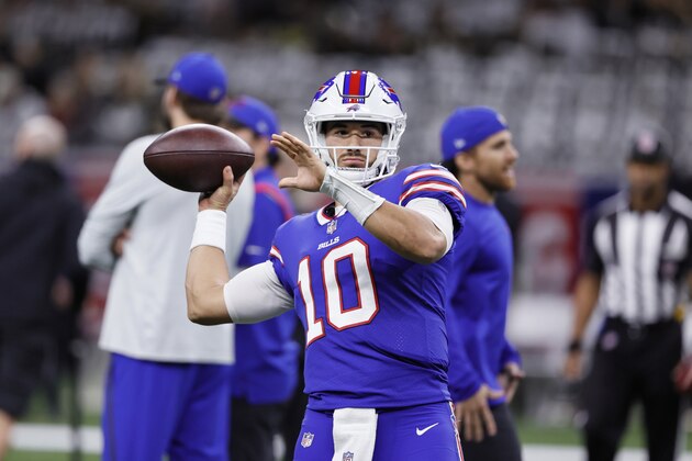 Buffalo Bills quarterback Mitchell Trubisky (10) warms up before an NFL football game against the New Orleans Saints in New Orleans, Thursday, Nov. 25, 2021. (AP Photo/Butch Dill)
