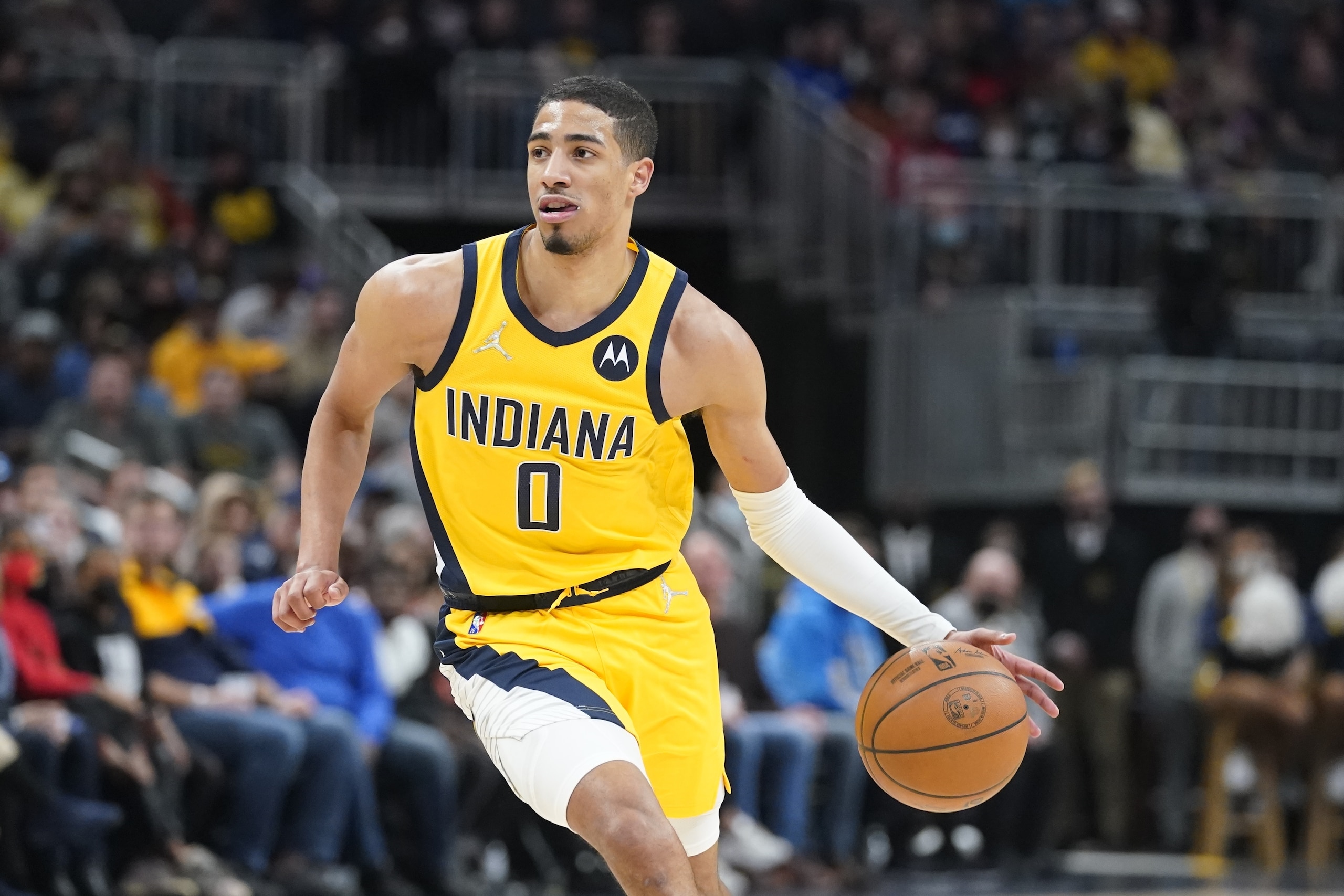 Indiana Pacers' Tyrese Haliburton (0) dribbles during the second half of an NBA basketball game against the Cleveland Cavaliers, Friday, Feb. 11, 2022, in Indianapolis. Cleveland won 120-113. (AP Photo/Darron Cummings)