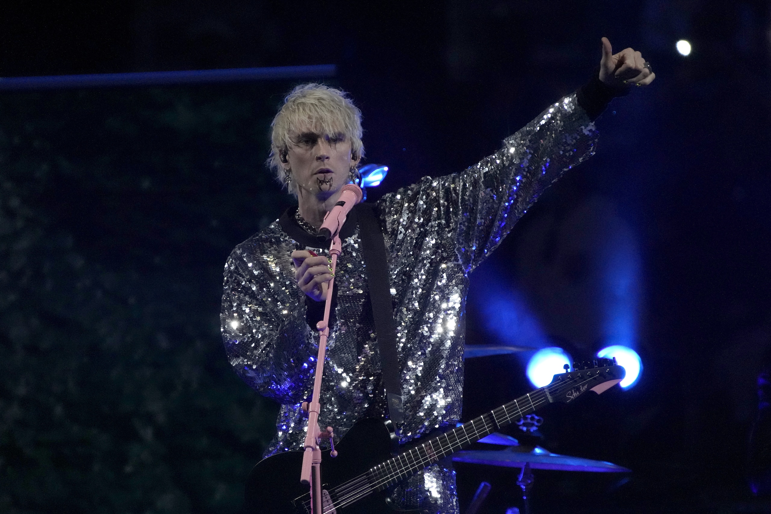 Machine Gun Kelly performs during an intermission at the NHL All-Star hockey game Saturday, Feb. 5, 2022, in Las Vegas. (AP Photo/Rick Scuteri)