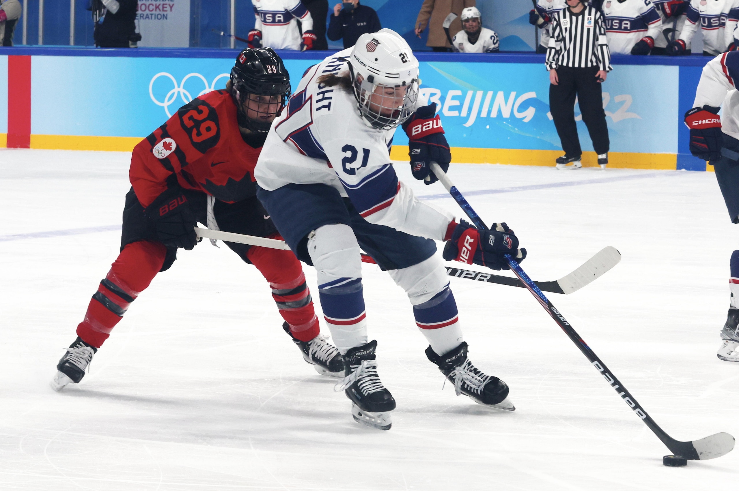 BEIJING, CHINA - FEBRUARY 17: Marie-Philip Poulin #29 of Team Canada in action with Hilray Knight #21 of Team United States during the Women's Ice Hockey Gold Medal match between Team Canada and Team United States on Day 13 of the Beijing 2022 Winter Olympic Games at Wukesong Sports Centre on February 17, 2022 in Beijing, China. (Photo by Xavier Laine/Getty Images)