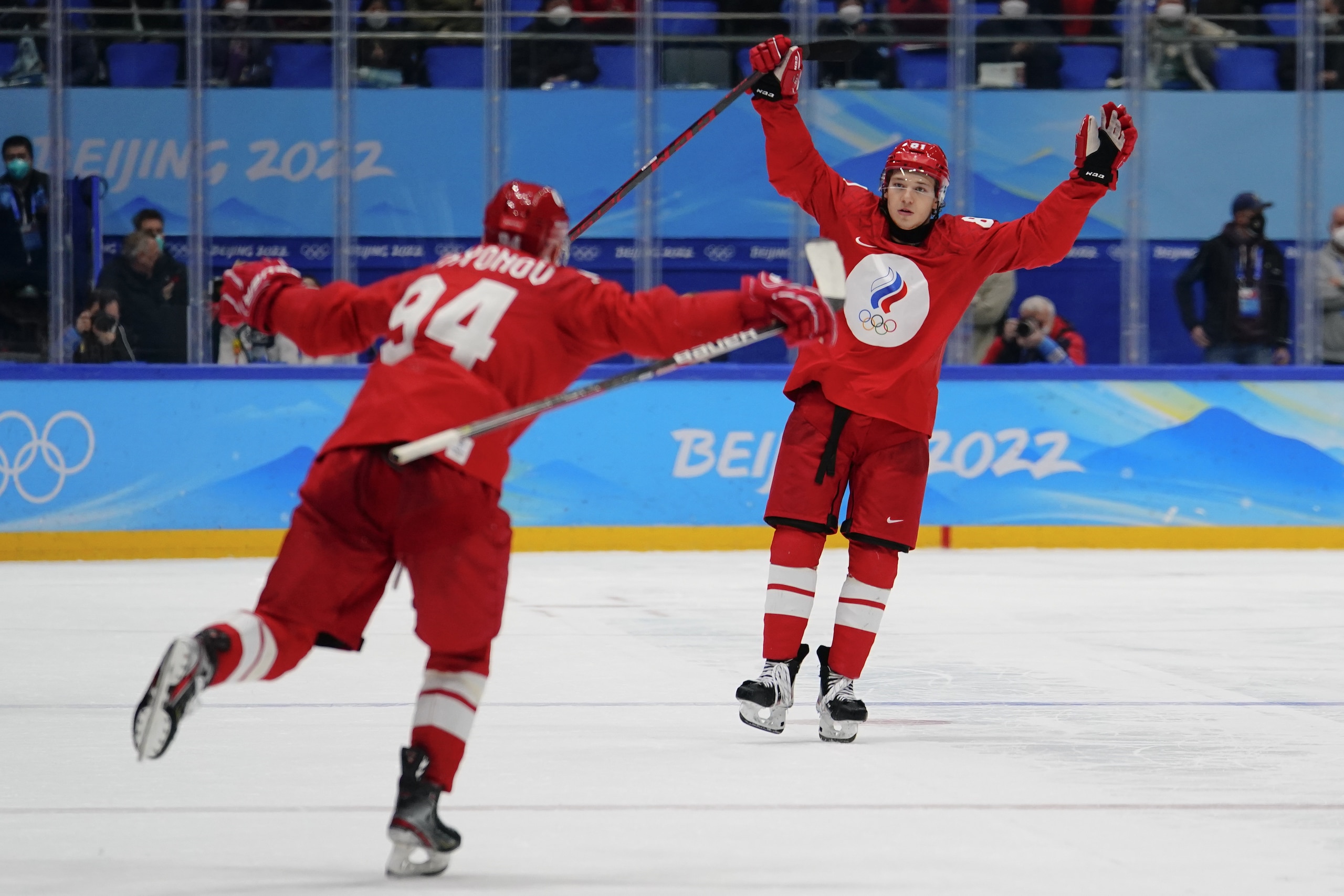 Russian Olympic Committee's Arseni Gritsyuk, right, celebrates with Kirill Semyonov (94) after Gritsyuk scored the winning shootout goal against Sweden in a men's semifinal hockey game at the 2022 Winter Olympics, Friday, Feb. 18, 2022, in Beijing. (AP Photo/Matt Slocum)