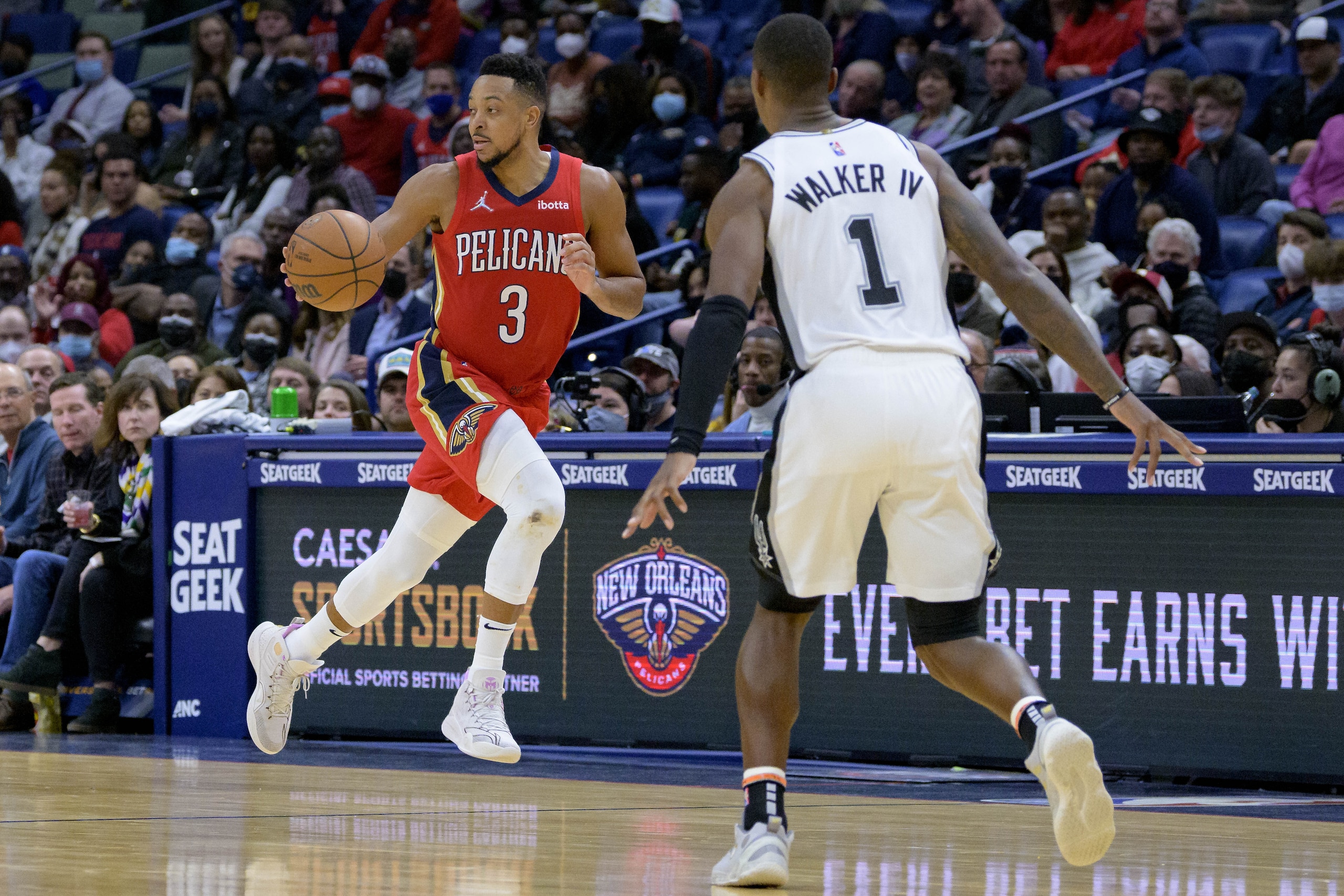 New Orleans Pelicans guard CJ McCollum (3) dribbles during an NBA basketball game against the San Antonio Spurs in New Orleans, Saturday, Feb. 12, 2022. (AP Photo/Matthew Hinton)