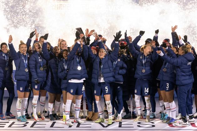 The U.S. team hoists the SheBelieves Cup trophy after a 5-0 win over Iceland in a soccer match Wednesday, Feb. 23, 2022 in Frisco, Texas. (AP Photo/Jeffrey McWhorter)