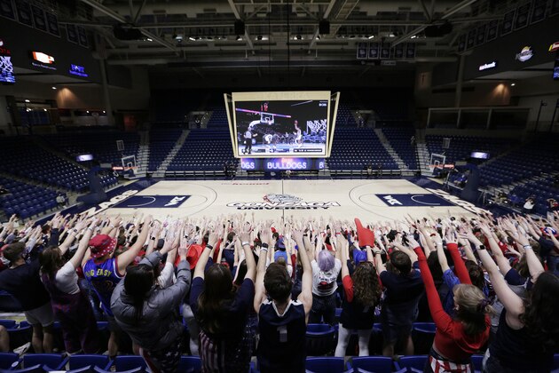 Gonzaga fans react while watching the NCAA Final Four college championship basketball game between Gonzaga and Baylor during a watch party at the McCarthey Athletic Center in Spokane, Wash., Monday, April 5, 2021. (AP Photo/Young Kwak) Gonzaga fans react while watching the NCAA Final Four college championship basketball game between Gonzaga and Baylor during a watch party at the McCarthey Athletic Center in Spokane, Wash., Monday, April 5, 2021. (AP Photo/Young Kwak)