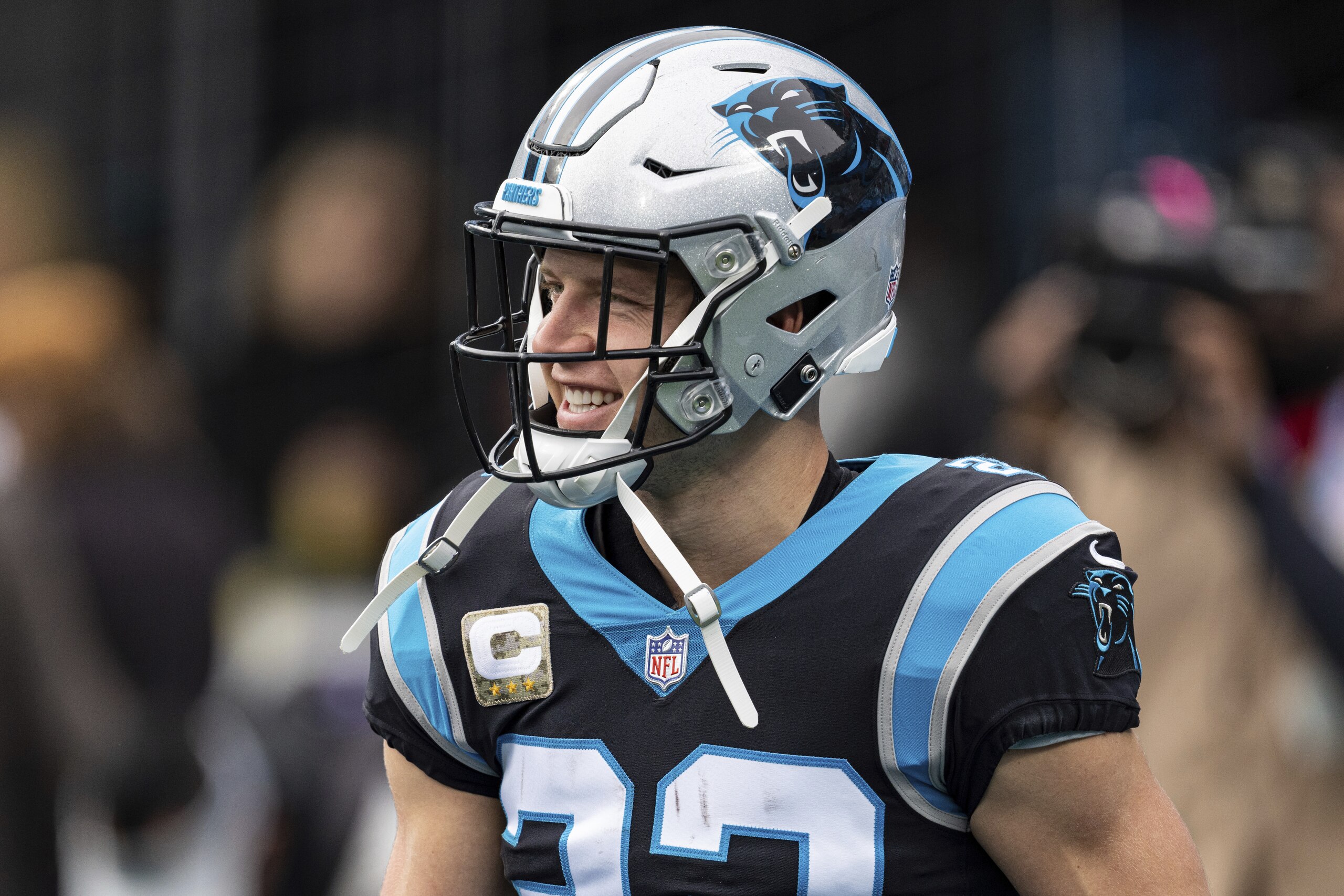 Carolina Panthers running back Christian McCaffrey (22) warms up before an NFL football game against the Washington Football Team Sunday, Nov. 21, 2021, in Charlotte, N.C. (AP Photo/Jacob Kupferman)