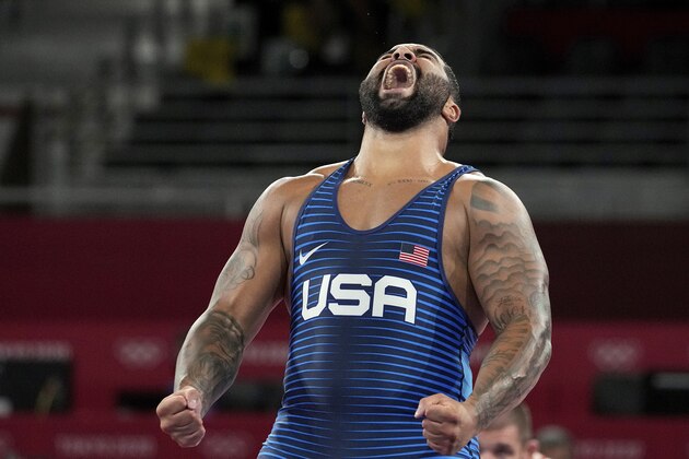 FILE - In this Aug. 6, 2021, file photo, United States' Gable Dan Steveson celebrates after defeating Georgia's Gennadij Cudinovic during their men's freestyle 125kg wrestling final match at the 2020 Summer Olympics in Chiba, Japan. Steveson has achieved his childhood dream of signing with World Wrestling Entertainment, but with a twist. The WWE announced Thursday that it has signed Steveson to an exclusive NIL deal that will allow him to join the WWE roster and return to the University of Minnesota to defend his college heavyweight wrestling title. It is the WWEâ€™s first NIL deal. (AP Photo/Aaron Favila, File)