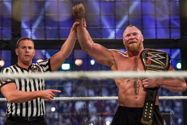 Brock Lesnar (R) is declared champion following the 2022 World Wrestling Entertainment (WWE) Elimination Chamber at the Jeddah Super Dome in Saudi Arabia's Red Sea coastal city of Jeddah on February 19, 2022. (Photo by Amer HILABI / AFP) (Photo by AMER HILABI/AFP via Getty Images) Brock Lesnar (R) is declared champion following the 2022 World Wrestling Entertainment (WWE) Elimination Chamber at the Jeddah Super Dome in Saudi Arabia's Red Sea coastal city of Jeddah on February 19, 2022. (Photo by Amer HILABI / AFP) (Photo by AMER HILABI/AFP via Getty Images)