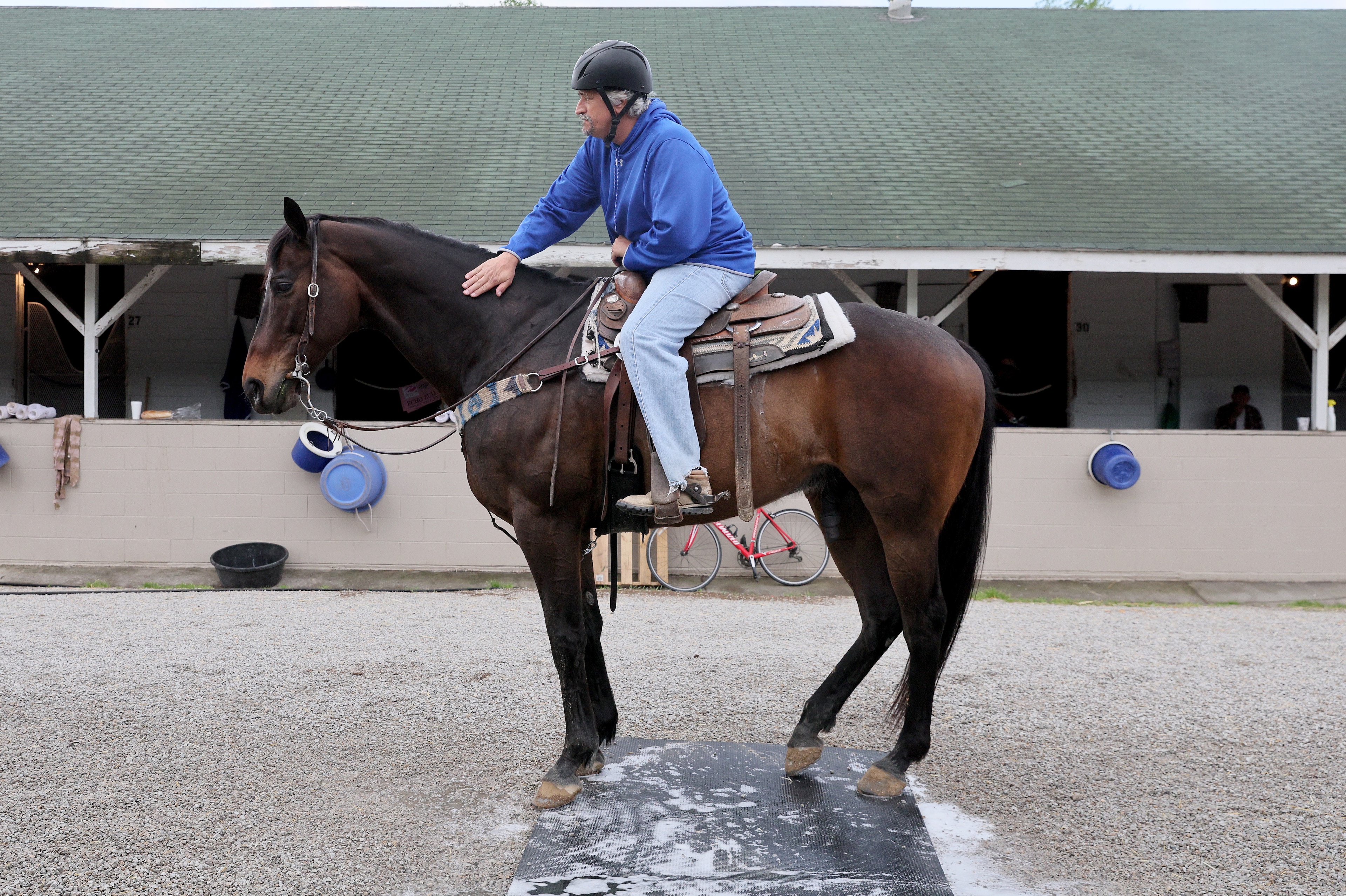 LOUISVILLE, KENTUCKY - MAY 01: Steve Asmussen the trainer of Epicenter in the barn area during morning training for the Kentucky Derby at Churchill Downs on May 01, 2022 in Louisville, Kentucky. (Photo by Andy Lyons/Getty Images) LOUISVILLE, KENTUCKY - MAY 01: Steve Asmussen the trainer of Epicenter in the barn area during morning training for the Kentucky Derby at Churchill Downs on May 01, 2022 in Louisville, Kentucky. (Photo by Andy Lyons/Getty Images)
