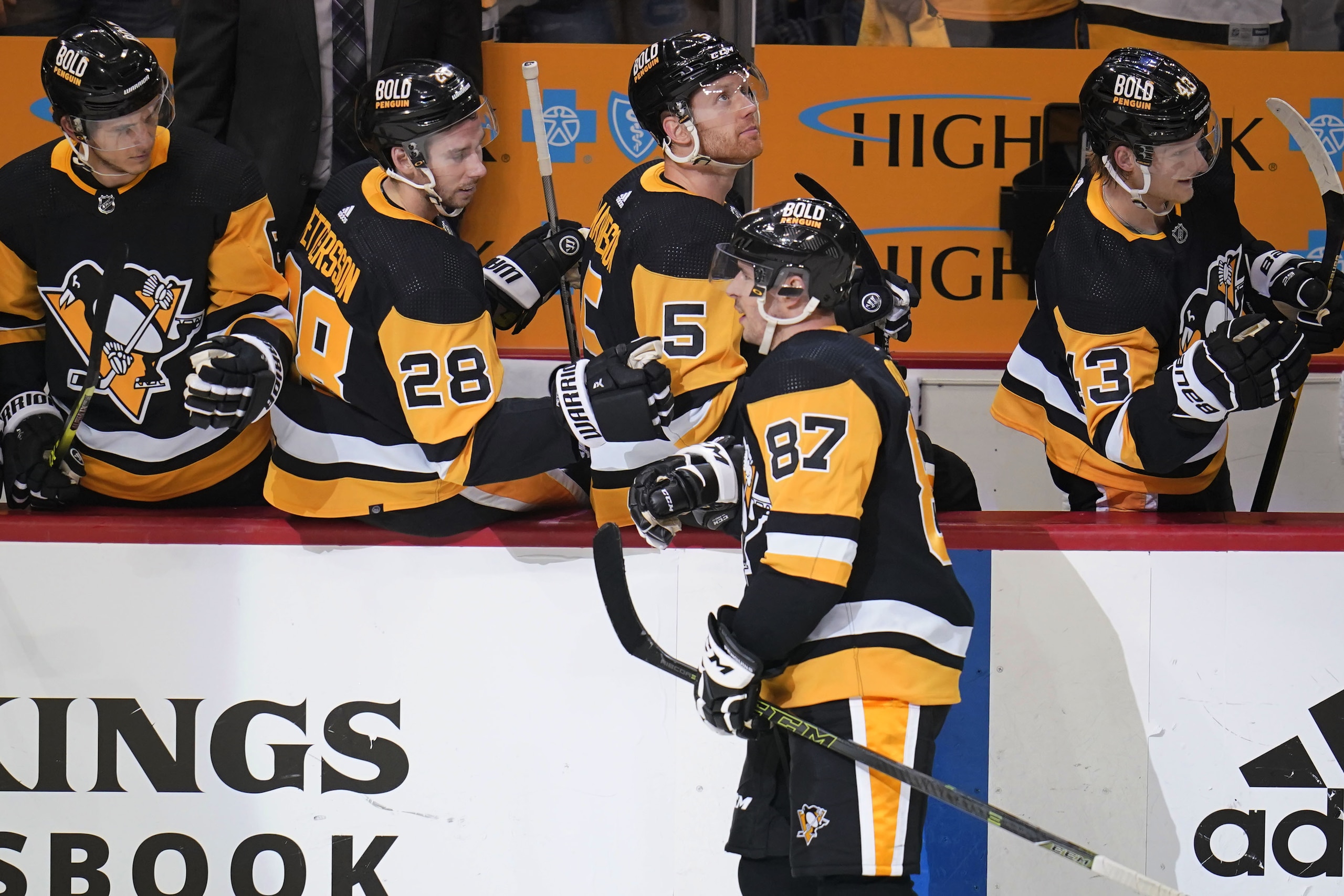 Pittsburgh Penguins' Sidney Crosby (87) returns to the bench after scoring during the first period in Game 4 of an NHL hockey Stanley Cup first-round playoff series against the New York Rangers in Pittsburgh, Monday, May 9, 2022. (AP Photo/Gene J. Puskar)