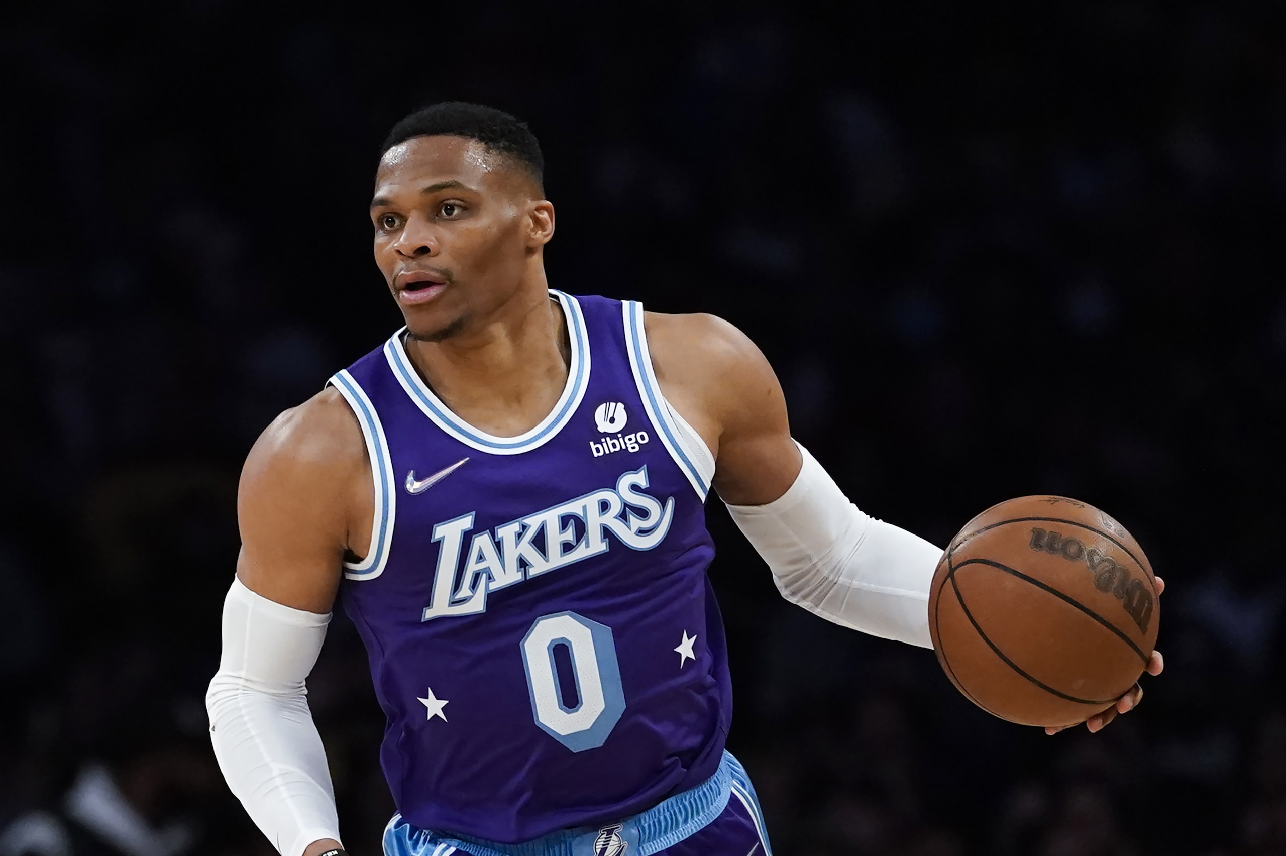 Los Angeles Lakers guard Russell Westbrook (0) controls the ball during an NBA basketball game against the New Orleans Pelicans in Los Angeles, Friday, April 1, 2022. (AP Photo/Ashley Landis)
