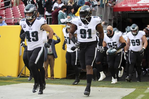 Philadelphia Eagles defensive tackle Fletcher Cox (91) leads out his team before an NFL football game against the Washington Football Team, Sunday, Jan. 02, 2022 in Landover. (AP Photo/Daniel Kucin Jr.)