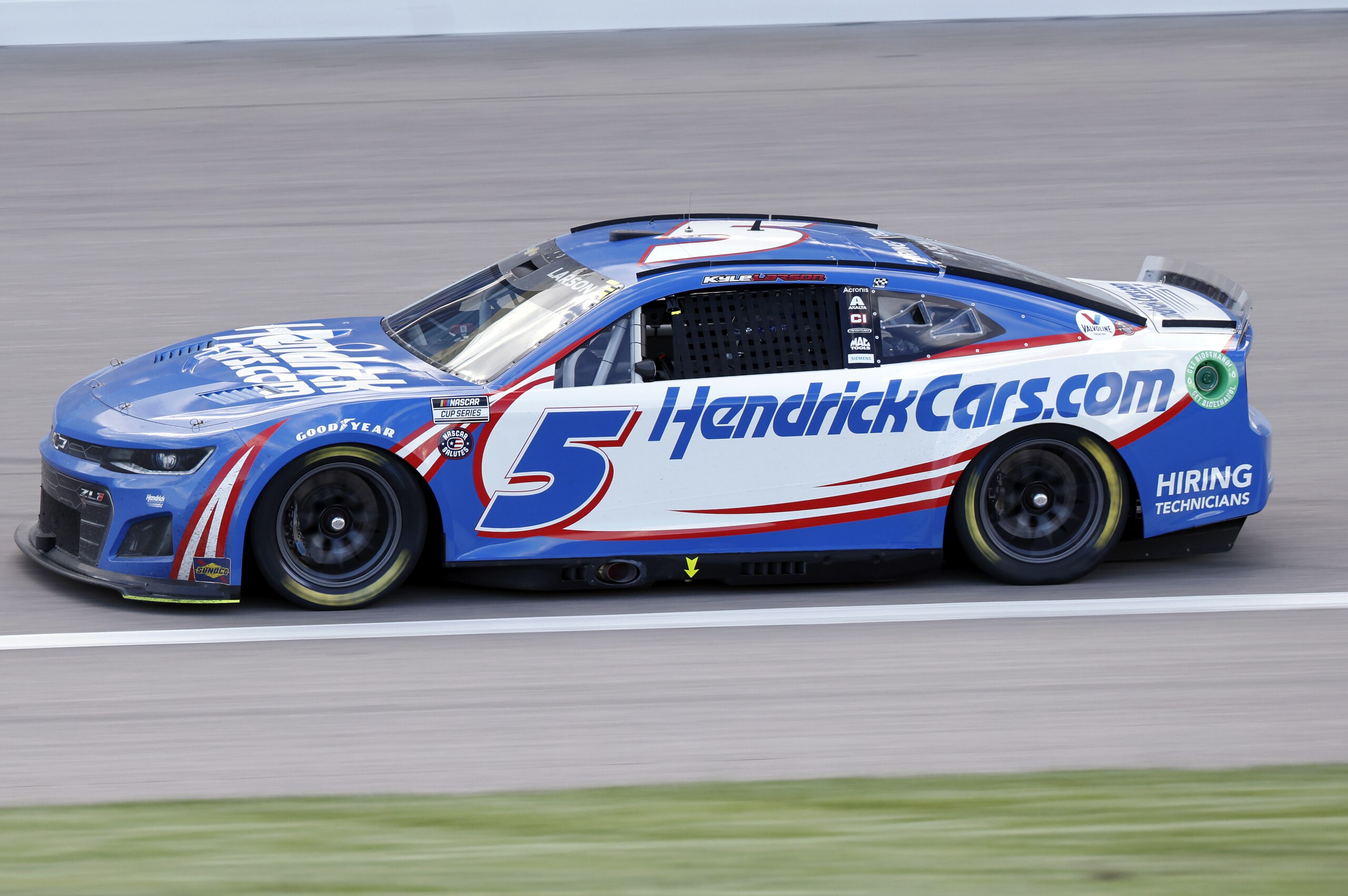 Kyle Larson (5) heads down the front straightaway during a NASCAR Cup Series auto race at Kansas Speedway in Kansas City, Kan., Sunday, May 15, 2022. (AP Photo/Colin E. Braley)