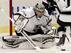 Los Angeles Kings goalie Jonathan Quick makes the save on a shot by Chicago Blackhawks' Patrick Sharp during the second period of an NHL hockey game in Chicago on Wednesday, Dec. 28, 2011. (AP Photo/Nam Y. Huh)