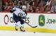 Winnipeg Jets' Andrew Ladd skates against the Carolina Hurricanes during the first period of an NHL hockey game in Raleigh, N.C., Friday, Nov. 25, 2011. (AP Photo/Gerry Broome)