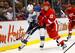 St. Louis Blues center David Backes (42) and Detroit Red Wings defenseman Jonathan Ericsson (52), of Sweden, battle for the puck in the first period of an NHL hockey game in Detroit, Saturday, Dec. 31, 2011. (AP Photo/Rick Osentoski)