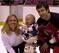 New Jersey Devils defenseman Scott Niedermayer's son, Logan, sits in the Stanley Cup as Scott, right, and his wife, Lisa, pose with the cup after the team picture Monday, June 12, 2000, in East Rutherford, N.J. The Devils defeated the Dallas Stars for th