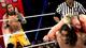 One of the Uso brothers looks on as the other is pummeled by Jack Swagger. (Courtesy of WWE.com)