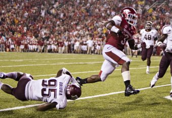 Alex Collins runs for a touchdown against Texas A&M.