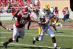 Defensive end Trey Flowers attempts to bring down a Southern Miss runner.