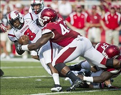 Defensive end Chris Smith brings down Louisiana quarterback Terrance Broadway.