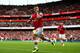 Child's play: Wilshere celebrates his wonder strike against the Canaries
