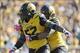 Missouri defensive end Michael Sam (No. 52) is the Tigers' answer to South Carolina's Jadeveon Clowney.