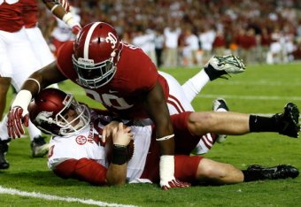 QB Brandon Allen is sacked against Alabama.