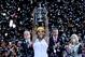 Serena Williams hoists trophy at 2013 WTA Championships.